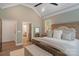 Main bedroom featuring vaulted ceilings, a large window, and access to the ensuite bathroom at 1428 Spring Ridge Ln, Denver, NC 28037