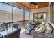Relaxing screened porch offers comfortable seating, a dining area, and views of the backyard at 1428 Spring Ridge Ln, Denver, NC 28037