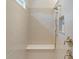 Bright walk-in shower features a bench seat, handheld shower head, window, and a built-in soap niche at 1428 Spring Ridge Ln, Denver, NC 28037