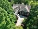 Aerial view of charming home with lush landscaping, long driveway at 154 Patterson'S Bridge None, New London, NC 28127