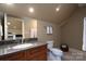 Bathroom with granite countertop and dark wood cabinets at 154 Patterson'S Bridge None, New London, NC 28127