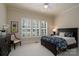 Comfortable bedroom featuring a dark wood bed with patterned bedding and bright natural light at 154 Patterson'S Bridge None, New London, NC 28127