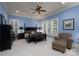 Light-filled primary bedroom with sitting area and custom crown molding at 154 Patterson'S Bridge None, New London, NC 28127