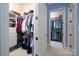 Organized walk-in closet with custom shelving, hanging rods, and a neat display of clothes and accessories at 154 Patterson'S Bridge None, New London, NC 28127