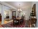 Formal dining room with a large window and adjacent sitting room at 154 Patterson'S Bridge None, New London, NC 28127