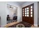 Foyer area featuring a wooden door, hardwood floors, and an open view to the office at 154 Patterson'S Bridge None, New London, NC 28127