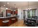 Open kitchen with center island, cherry wood cabinets, stainless appliances, and breakfast nook at 154 Patterson'S Bridge None, New London, NC 28127