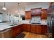 Kitchen with granite counters, stainless appliances, custom cabinets, and a center island at 154 Patterson'S Bridge None, New London, NC 28127