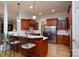 Well-equipped kitchen featuring a breakfast bar, wooden cabinetry, and stainless steel appliances at 154 Patterson'S Bridge None, New London, NC 28127