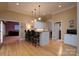 A kitchenette area with bar top seating, granite counters and light wood floors at 154 Patterson'S Bridge None, New London, NC 28127