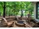 This patio features an outdoor fire pit, seating, and natural surroundings at 154 Patterson'S Bridge None, New London, NC 28127