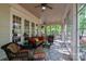 This sunroom features beautiful outdoor views, ample seating, and overhead fans at 154 Patterson'S Bridge None, New London, NC 28127
