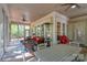 This sunroom features beautiful outdoor views, ample seating, and overhead fans at 154 Patterson'S Bridge None, New London, NC 28127
