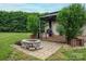 Inviting backyard featuring a stone fire pit and a gazebo with comfortable seating at 1774 Smyrna Ln, Catawba, NC 28609
