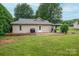Charming backyard with a well-maintained lawn, wooden deck, and a shaded gazebo at 1774 Smyrna Ln, Catawba, NC 28609