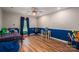 ' bedroom with blue and white walls, wood-look flooring, a bed and desk, and room to play at 1774 Smyrna Ln, Catawba, NC 28609