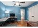 Bedroom with hardwood floors, work space, ceiling fan, and spacious closet at 1774 Smyrna Ln, Catawba, NC 28609