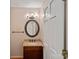 Charming powder room with granite countertop and a decorative mirror at 188 Stonemarker Rd, Mooresville, NC 28117
