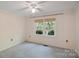 Cozy bedroom with a ceiling fan and a window providing natural light at 188 Stonemarker Rd, Mooresville, NC 28117