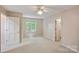 Bright bedroom with a ceiling fan and light colored walls at 188 Stonemarker Rd, Mooresville, NC 28117