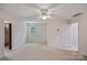 This cozy bedroom features a ceiling fan and neutral carpeting at 188 Stonemarker Rd, Mooresville, NC 28117