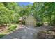 House exterior with an attached two car garage and natural landscaping at 188 Stonemarker Rd, Mooresville, NC 28117