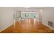 Spacious living room with hardwood floors, built-in shelving, a fireplace, and lots of natural light at 188 Stonemarker Rd, Mooresville, NC 28117