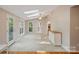 Sun room with tile floors, natural light, fan, and access to a backyard deck at 188 Stonemarker Rd, Mooresville, NC 28117