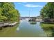 Picturesque view of the lake with docks and boat houses at 188 Stonemarker Rd, Mooresville, NC 28117