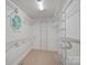 Walk-in closet with adjustable wire shelving and a small window at 188 Stonemarker Rd, Mooresville, NC 28117