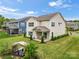 Expansive backyard featuring a covered patio with seating and a beautifully landscaped lawn at 1918 Thoreau Way, York, SC 29745