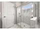 Modern shower with glass door and marble tile surround in this bathroom at 1918 Thoreau Way, York, SC 29745