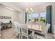 Bright dining area with a large window and contemporary furnishings at 1918 Thoreau Way, York, SC 29745