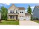Charming two-story home with a two-car garage and a beautifully landscaped front yard at 1918 Thoreau Way, York, SC 29745