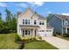 Stunning two-story home with attached two-car garage and manicured landscaping at 1918 Thoreau Way, York, SC 29745