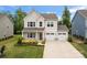 Attractive two-story home with a two-car garage and well-manicured lawn at 1918 Thoreau Way, York, SC 29745