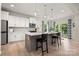 Modern kitchen with stainless steel appliances, island, and stylish pendant lighting at 1918 Thoreau Way, York, SC 29745