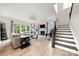 Spacious living room with a fireplace, hardwood floors, and staircase, perfect for modern living and entertaining at 1918 Thoreau Way, York, SC 29745