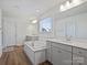 Bright bathroom with double vanities, a soaking tub, and modern fixtures at 2025 Sweet Magnolia Ln, Clover, SC 29710