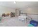 Upstairs bonus room featuring a play area with a table, chairs, and storage at 2025 Sweet Magnolia Ln, Clover, SC 29710