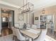 Open-concept dining area adjacent to a chef's kitchen, featuring hardwood floors at 2025 Sweet Magnolia Ln, Clover, SC 29710