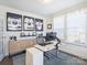 Bright home office featuring a modern stand-up desk, ample storage, and sporty decor at 2025 Sweet Magnolia Ln, Clover, SC 29710