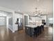Modern kitchen with stainless steel appliances, large island, and sleek white cabinets at 2025 Sweet Magnolia Ln, Clover, SC 29710