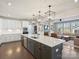 Spacious kitchen with large island, stainless steel appliances, and open to the living area at 2025 Sweet Magnolia Ln, Clover, SC 29710