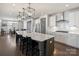 Open kitchen with long island, breakfast bar, and modern lighting at 2025 Sweet Magnolia Ln, Clover, SC 29710