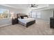 Carpeted primary bedroom featuring neutral tones, a ceiling fan, and natural light at 2025 Sweet Magnolia Ln, Clover, SC 29710
