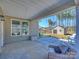 Covered patio showing a well-maintained outdoor space, views of the shed and backyard at 2025 Sweet Magnolia Ln, Clover, SC 29710