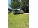 A spacious green backyard featuring a single-story home at 203 Blanche Ave, Belmont, NC 28012