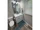 Bathroom with a vanity, toilet, and a window at 203 Blanche Ave, Belmont, NC 28012