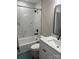 Modern bathroom with a shower-tub combo and marble countertop vanity at 203 Blanche Ave, Belmont, NC 28012